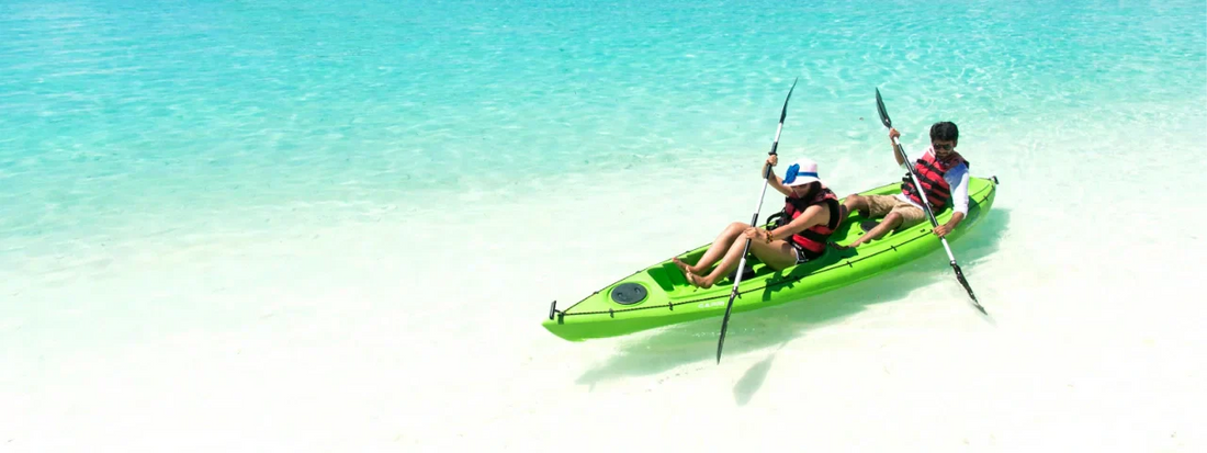 Couple kayaking in the sunny waters of the Maldives, representing active lifestyles, mobility, and joint health supported by Supple joint supplements.