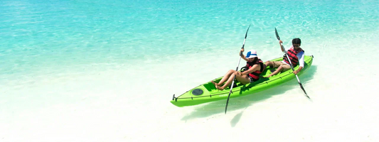 Couple kayaking in the sunny waters of the Maldives, representing active lifestyles, mobility, and joint health supported by Supple joint supplements.