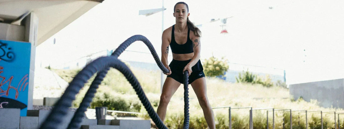Woman holding fitness ropes at the gym, ready to work out—representing strength, mobility, and joint support with Supple joint health supplements.