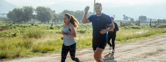 A man and woman on a trail run, representing active lifestyles supported by Supple joint health supplements with glucosamine, chondroitin, and boswellia.